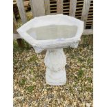 A BALLUSTER STYLE STONEWORK GARDEN BIRD BATH - HEIGHT 60 CM.