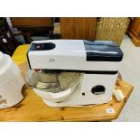 A KENWOOD CHEF FOOD MIXER WITH ATTACHMENTS ALONG WITH A MOULINEX JUICER - SOLD AS SEEN