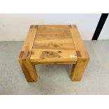 A HEAVY HARDWOOD RUSTIC LAMP TABLE - W 60CM. D 60CM. H 41CM.