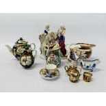 A HIGHLY DECORATIVE PORCELAIN TEAPOT ALONG WITH MATCHING COVERED JUG,