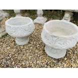 A PAIR OF STONEWORK GARDEN PLANTERS WITH SCROLLED DESIGN - HEIGHT 41 CM. DIAMETER 42 CM.