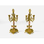 A PAIR OF CONTINENTAL ORNATE BRASS CANDELABRA GARNITURES P.H.