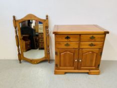 A HONEY PINE DRESSER BASE THE FOUR DRAWERS ABOVE TWO CABINET DOORS ALONG WITH A HONEY PINE FRAMED