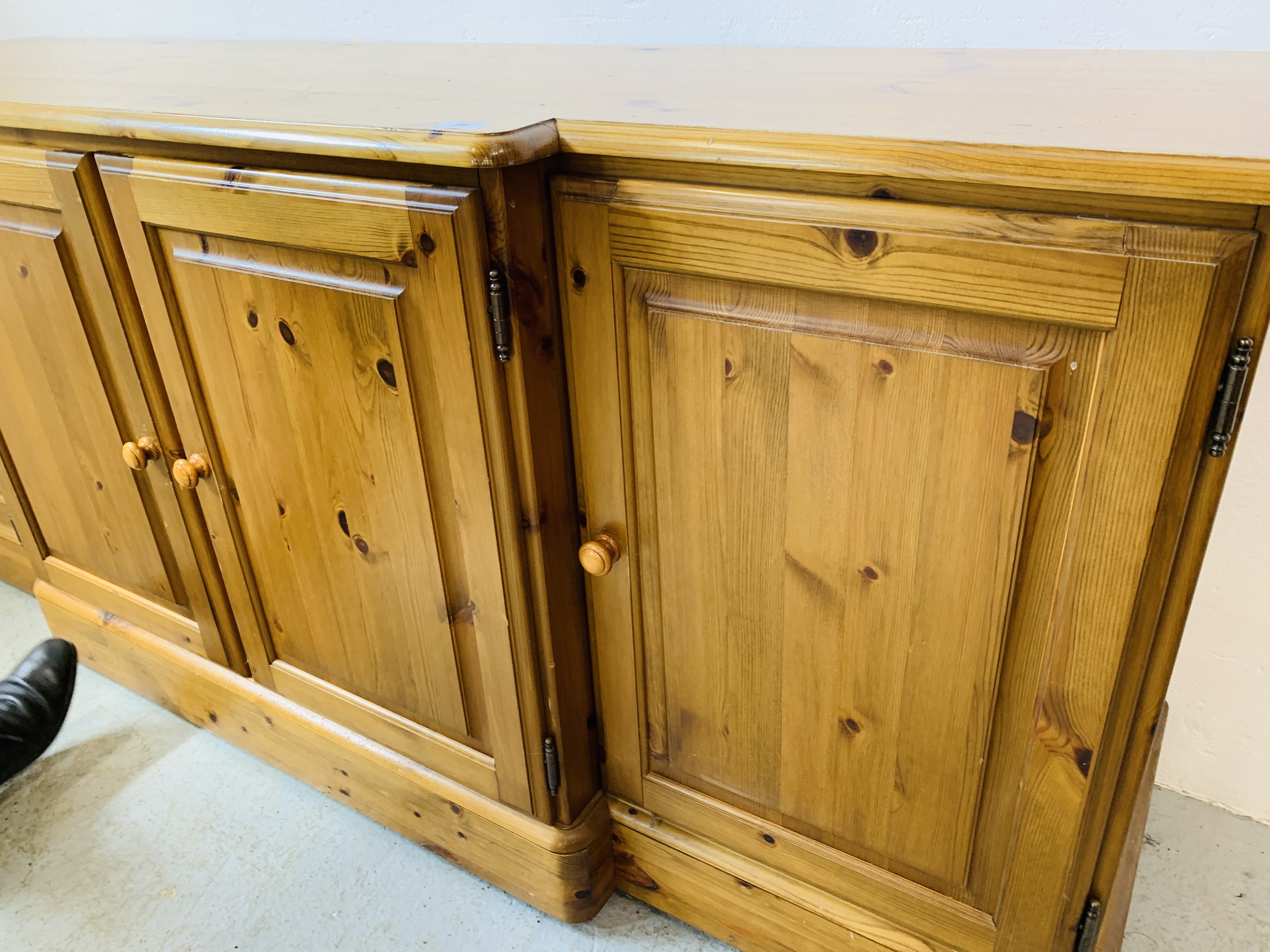 A DUCAL HONEY PINE BREAK FRONT FOUR DOOR DRESSER BASE - W 175 CM. D 46CM. H 75CM. - Image 9 of 9