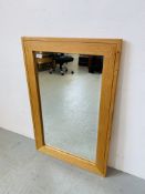 A MODERN LIGHT OAK RECTANGULAR WALL MIRROR WITH BEVELLED PLATE GLASS. W 61CM. H 91CM.