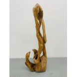 A HARDWOOD ABSTRACT SCULPTURE "FAMILY" BY P.T.