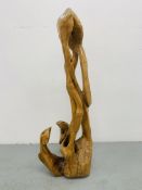 A HARDWOOD ABSTRACT SCULPTURE "FAMILY" BY P.T.