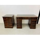 A REPRODUCTION MAHOGANY FINISH NINE DRAWER KNEE HOLE DESK WITH GREEN TOOLED LEATHER INSERT TO TOP