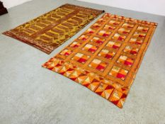 AN ORIENTAL SILK EMBROIDED THROW - ORANGE / PINK 225CM X 125CM ALONG WITH ONE OTHER ORANGE / YELLOW