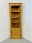 A WAXED PINE FULL HEIGHT CORNER SHELF UNIT WITH CABINET TO BASE H 198CM,