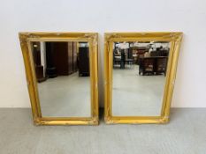 A PAIR OF REPRODUCTION CLASSICAL GILT FRAMED RECTANGULAR WALL MIRRORS WITH BEVELLED PLATE GLASS