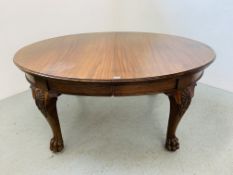 AN EXTENDING OVAL MAHOGANY DINING TABLE CABRISLE LEG FINISHING IN BALL & CLAW DETAIL WIND OUT