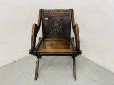 A GLASTONBURY OAK PRIESTS CHAIR WITH HAND CARVED PANEL DETAIL