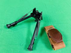 A HARRIS 30CM BIPOD NON STEP LOCKING ALONG WITH A CANVAS RIFLE SLING