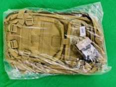 A "IN YOUR SIGHTS" MIL-TEC COMBAT BACK PACK TAGGED AS NEW
