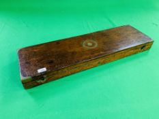 AN ANTIQUE OAK MOTORING CASE WITH BRASS BANDING AND FIXTURES