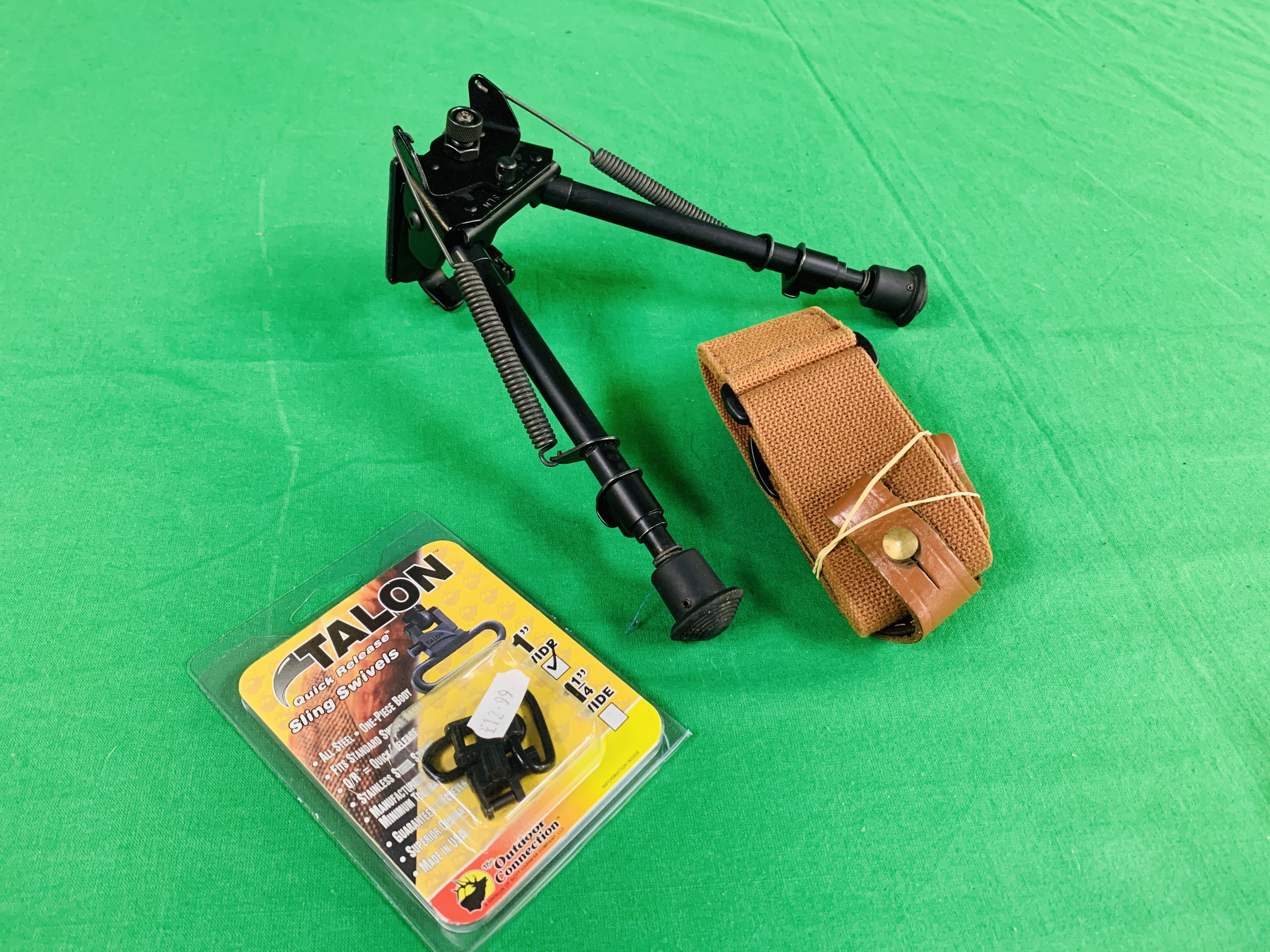 A HARRIS 30CM BIPOD STEP LOCKING ALONG WITH A CANVAS RIFLE SLIP AND SWING SWIVELS