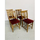 A SET OF FOUR CHAPEL CHAIRS WITH RED VELOUR UPHOLSTERED SEATS