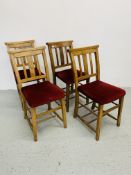 A SET OF FOUR CHAPEL CHAIRS WITH RED VELOUR UPHOLSTERED SEATS