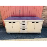 A MOFFATT STAINLESS STEEL WHEELED CABINET WITH FOUR DRAWERS AND FOUR CABINET DOORS L 180CM, D 70CM,