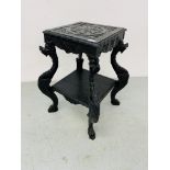 A HIGHLY DECORATIVE OAK TWO TIER STAND THE SUPPORTS DETAILED AS MYTHICAL CREATURES