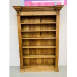 A SOLID WAXED PINE FULL HEIGHT BOOKSHELF - H 198 CM. W 138CM.