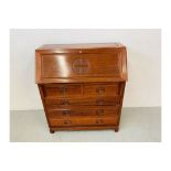 A REPRODUCTION HARDWOOD FIVE DRAWER BUREAU WITH CARVED "LONG LIFE" DESIGN TO FRONT PANEL AND DRAWER
