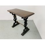 A SMALL RECTANGULAR VINTAGE BAR TABLE WITH HEAVY ORNATE CAST IRON BASE. L 92CM. W 45CM. H 75CM.