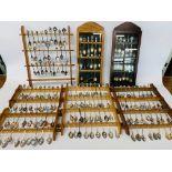 LARGE COLLECTION OF COLLECTOR'S SOUVENIR SPOONS - MANY WITH ENAMELED DETAIL IN WOODEN DISPLAYS