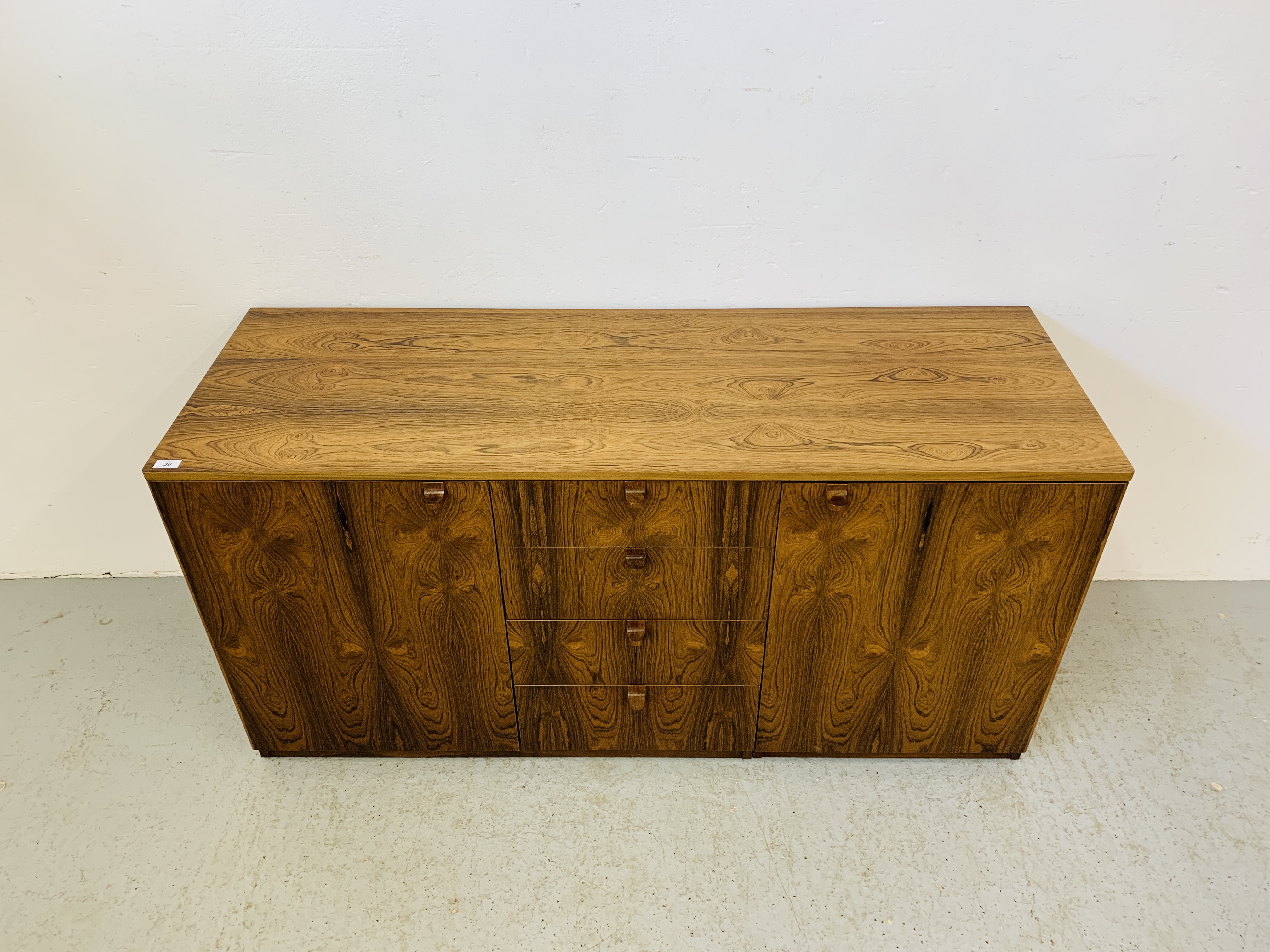 A C20TH BRAZILIAN ROSEWOOD RETRO SIDEBOARD HAVING FOUR CENTRAL DRAWERS FLANKED BY CUPBOARDS TO - Image 3 of 15