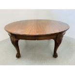 A MAHOGANY EXTENDING DINING TABLE