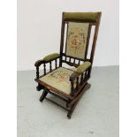 AN EDWARDIAN ROCKING CHAIR WITH TAPESTRY UPHOLSTERED SEAT AND BACK