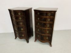 A PAIR OF REPRODUCTION MAHOGANY FINISH SERPENTINE FIVE DRAWER CHESTS