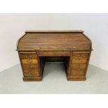 A VINTAGE OAK TWIN PEDESTAL KNEE HOLE DESK, THE TOP WITH ROLLING TIMBER COVER,