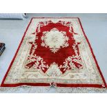 CHINESE RUG ON A RED BACKGROUND "DRAGON",