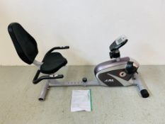 A JU RECUMBANT EXERCISE CYCLE WITH INSTRUCTIONS (UNUSED) - SOLD AS SEEN