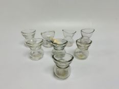 EIGHT CLEAR GLASS EYE BATHS INCLUDING SH