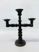 A RING TURNED OLIVE WOOD CANDELABRA WITH THREE CANDLE POTS. HEIGHT 30CM.