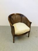 A WESLEY BARREL TUB CHAIR WITH RATTAN WORK AND CUSHIONED SEAT