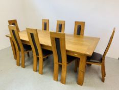 A SOLID OAK DINING TABLE AND EIGHT DINING CHAIRS. TABLE W 170CM. L 240CM.