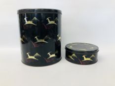 2 X VINTAGE TINS MARKED "BIBA" ON A MAINLY BLACK BACKGROUND WITH GOLD GAZELLE