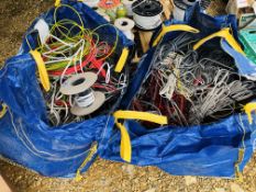 A LARGE QUANTITY OF ASSORTED SCRAP ELECTRICAL CABLE WITHIN TWO LARGE BUILDERS BAGS - SOLD AS SEEN