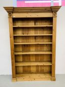 A SOLID WAXED PINE FULL HEIGHT BOOKSHELF - H 198 CM. W 138CM.