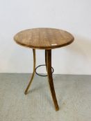 A CIRCULAR TRIPOD BASE OAK TABLE WITH METAL CRAFT DETAIL (CONVERTED FROM WHISKY BARREL)