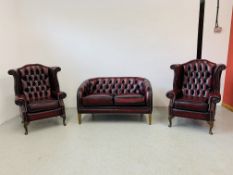 A PAIR OF GOOD QUALITY OXBLOOD LEATHER BUTTON BACK WINGED FIRESIDE CHAIRS AND OXBLOOD LEATHER