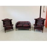 A PAIR OF GOOD QUALITY OXBLOOD LEATHER BUTTON BACK WINGED FIRESIDE CHAIRS AND OXBLOOD LEATHER