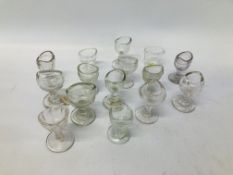 A GROUP OF 15 VINTAGE CLEAR GLASS EYE BATHS