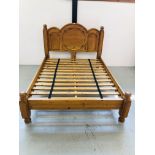 HEAVY SOLID PINE KINGSIZE BEDSTEAD WITH CARVED DETAIL TO HEADBOARD