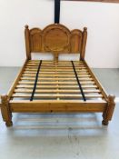 HEAVY SOLID PINE KINGSIZE BEDSTEAD WITH CARVED DETAIL TO HEADBOARD