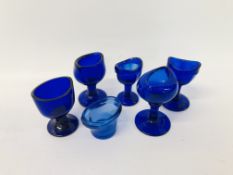 A GROUP OF 6 VINTAGE BLUE GLASS EYE BATHS